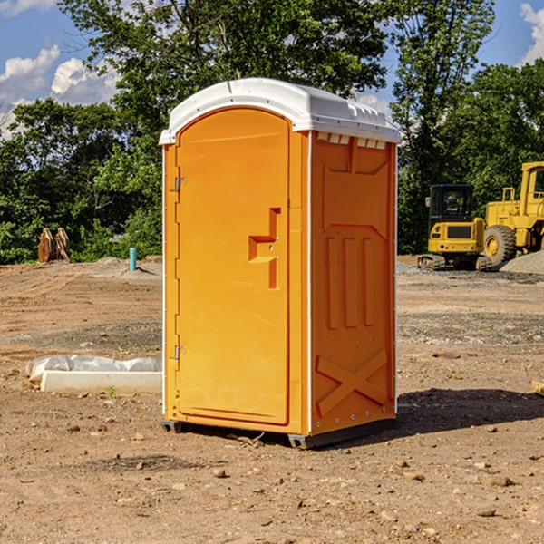 what is the cost difference between standard and deluxe portable toilet rentals in Meno